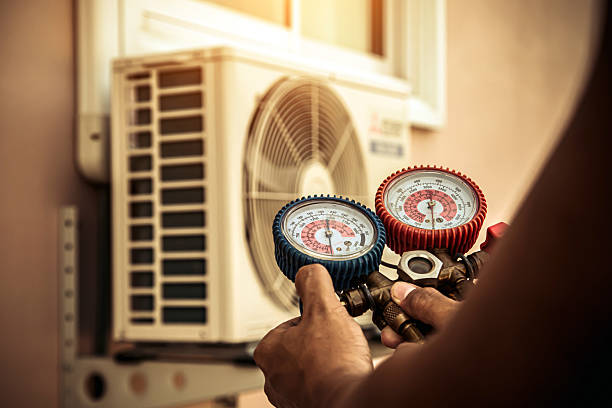 Professional Air Conditioning Service technician working in Lowell, MA